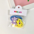 Set van twee cartoon beer haarelastiekjes in blauw en beige met plastic versieringen - Paars en Geel Beer Haarelastiekjes