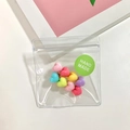 Kleurrijke hartvormige harskralen in zakje met groen handgemaakt label voor diy - Hart Suikerboon Haarclip