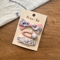 Ensemble d'accessoires cheveux fleuris rose et violet avec nœud sur carte beige - Ensemble Floral Rose