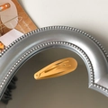 Single yellow glossy lacquered metal snap clip for kids in classic teardrop design - Light Orange