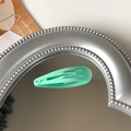 Matte mint green 5cm metal snap hair clip displayed on a silver vintage mirror surface - Mint Green