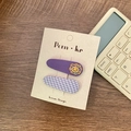 Set of two purple cartoon hair clips with smiley flower and plaid pattern on display card - Purple