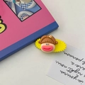 Cute cartoon character hair clip with brown bangs and yellow flower on a yellow base - Yellow