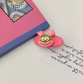 Pink cartoon monster hair clip with green eyes and funny Y2K aesthetic design - Rose Red