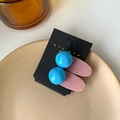 Cute bright blue spherical candy drop hair clip with pink velvet base on display card - Blue