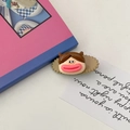 Funny cartoon character hair clip with large lips on decorative quote card background - Khaki