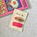 Pink fabric hair clips with flower embroidery and matte finish on display card - Embroidered Tulip And Square Clip