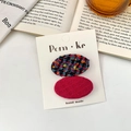 Oval fabric hair clip set in pink solid and tweed pattern on white card display - Red Series