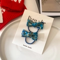 Blue satin bow hair ties with gold floral embroidery on a white display card - Blue