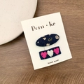 Blue floral fabric hair clip set with heart patterns on a white display card - Oval And Heart