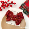 Red tweed bow hair clip with gold trim for girls on a wooden festive background - Large Plaid Bowknot Style