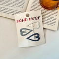 Three-piece matte heart-shaped hair clips in white and blue shades on card - Heart
