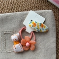 Lot de 3 accessoires cheveux fleurs avec nœud jaune et élastiques fleurs roses - Orange