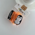 Kids hair clip set with cute penguin print and orange elastic bands on white background - Penguin