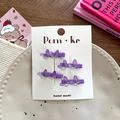 Set of four purple gradient resin butterfly hair clips on a white display card - Purple