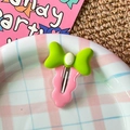 Cute green bow and pink cloud-shaped hair clip for girls on a checkered tray - Green Bow