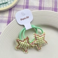 Elastic green plaid star hair ties with pink stitching on a white display tray - Green Star