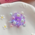 Elastico per capelli a spirale viola con perle colorate su piatto in ceramica - Viola