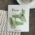 Coppia di fermagli per capelli a fiocco verde chiaro con pizzo bianco su carta - Fiocco Verde