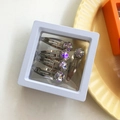 Lot de 5 pinces à cheveux argentées avec strass colorés dans une boîte flottante 3D - Mauve Clair