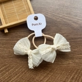 Set of two cream lace bow hair ties with elastic bands on dark wooden surface - Mesh Bow White / Two-Piece Set