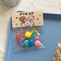 Bunte Kinder-Haargummis Set mit Bonbonfarbenen Perlen und elastischem Seil in süßer Verpackung - Punkt Haargummi