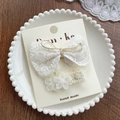 White lace hair clip set with butterfly bow and floral patterns on display card - Tied Bowknot
