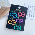Five colorful fruit-shaped cherry hair clips set in vibrant shades on black display card - Cherry Red and Blue