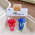 Bunte Zeichentrick-Haarspangen mit Wackelaugen für Mädchen in süßer Verpackung - Oktopus Serie Rot & Blau