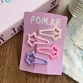 Set de 4 clips de estrella mate en crema, rosa y morado sobre tarjeta púrpura - Estrella Larga