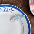 Sweet pink and white checkered hair clip with a light blue base on a white ceramic plate - Pink Plaid Blue Base