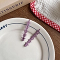 Set of two purple star-shaped hair clips with a matte finish for girls' styling - Purple Star