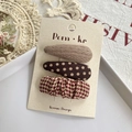 Three-piece hair clip set with brown knit patterns and polka dots on a display card - Brown Series