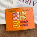 8-piece set of colorful kids hair clips with heart and fruit prints on orange card - Pink And Green Bow