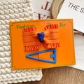 Set of orange bow hair clip and blue triangular metal hair pin on display card - Orange Bow And Blue Triangle Hair Clips Set