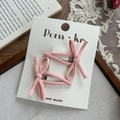 Set mit zwei rosa verknoteten Schleifen-Haarspangen auf einer Displaykarte mit Vintage-Stoff - Rosa Serie
