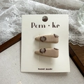 Paio di fermagli per capelli in tessuto beige a pois marroni su scheda display - Goccia Cammello
