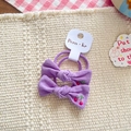 Set of two purple fabric bow hair ties featuring cute cherry embroidery on a display card - Purple