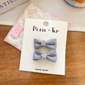 Pair of gray satin bow hair clips with silver glitter star on a display card - Gray Blue Bow Star Hair Clip
