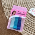 Glittery blue gradient hair clip set for kids on pink cardboard packaging display - Blue Series