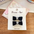 Deux barrettes à nœuds en satin noir avec détails d'étoiles argentées scintillantes - Barrette Nœud Étoile Noir