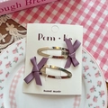Set of two purple satin ribbon bow hair clips on a white display card for girls - Fuschia
