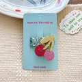 Sparkly glitter cherry hair clip for girls on handmade display card with blue background - Red Purple Cherry