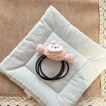 Handmade knitted pink bunny hair tie for girls with elastic band on fabric background - Pink Candy Bunny