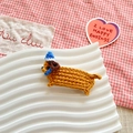 Handmade crochet dachshund hair clip in brown with a blue and white striped hat - Blue Hat Light Brown Dog