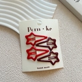 Star-shaped hair clips in red and burgundy on a minimalist handmade display card - Red Wine Red Star Paint Style (NK1195)