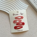 Set of four red floral and checkered teardrop hair clips on a cream card display - Dark Red Glitter Wavy Style (NK1195)
