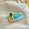 Handmade mint green crochet hair clip featuring a cute 3D yellow pear and white wavy edges - Lake Blue Pear