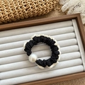 Polka dot lace scrunchie in black and white with a large pearl accent on velvet tray - Black Pearl