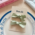 Sage green matte satin bow hair clips set for toddlers on a display card - Green